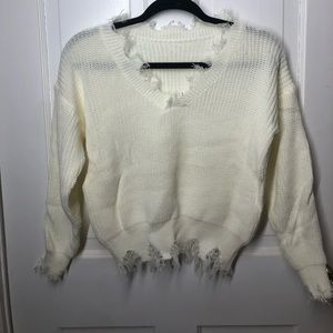 Distressed crop sweater